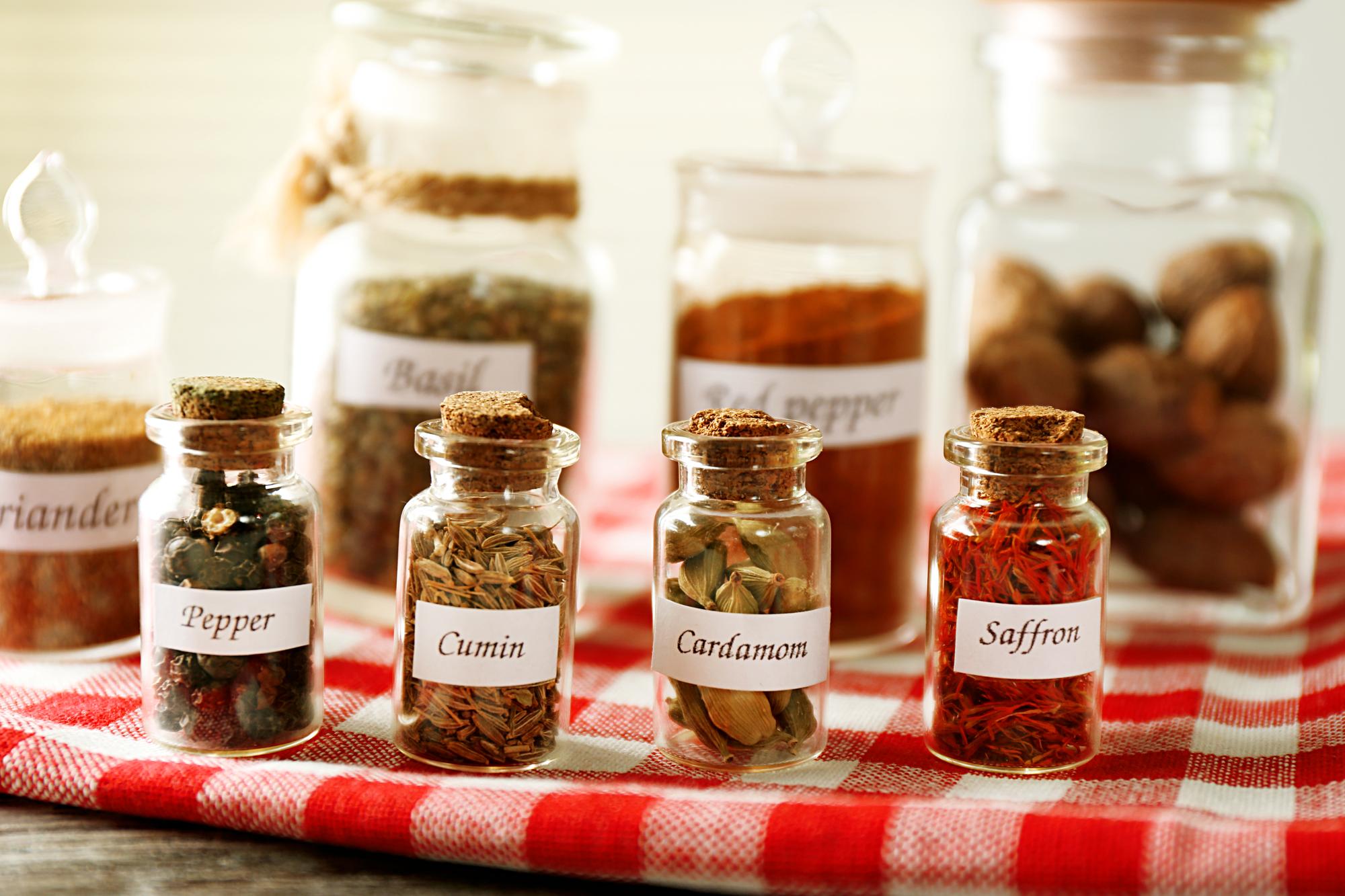 arranged spice jars with handwritten labels
